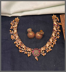 Elephant Necklace with Ruby Flower Small Pendant in Nakshi - NN00829