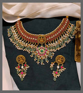 Elegant Lakshmi with Ruby Necklace and little Green Beads in Kundan - KN00533