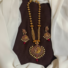Antique Polish Peacock Pendant With Ruby Bead - NH00507