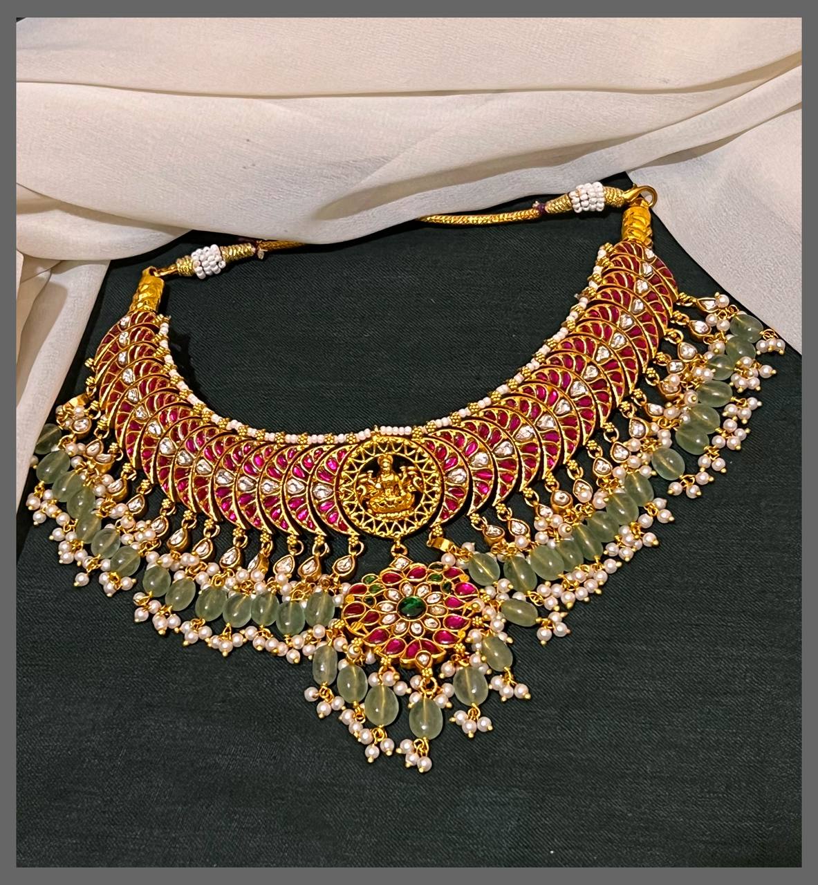 Elegant Lakshmi with Ruby Necklace and little Green Beads in Kundan - KN00533