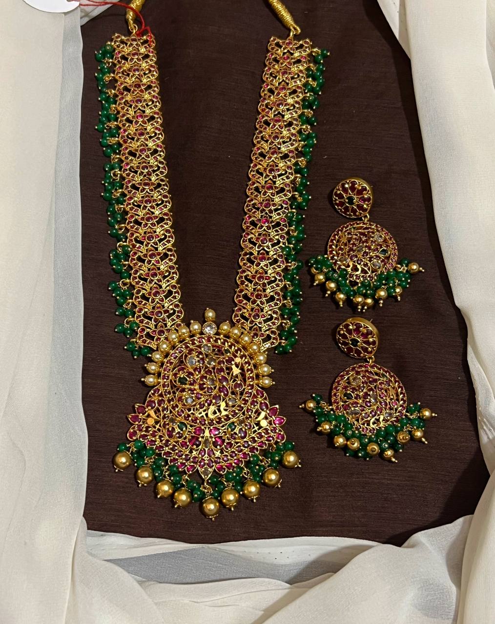 Kempu Stone Grand Haram With Peacock Pendant and Grand Earrings - NH00335