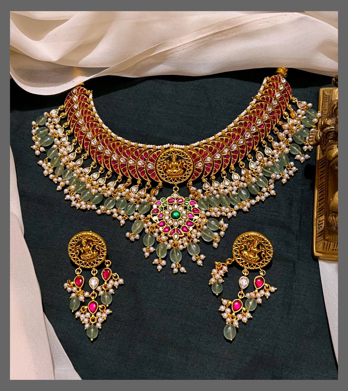 Elegant Lakshmi with Ruby Necklace and little Green Beads in Kundan - KN00533